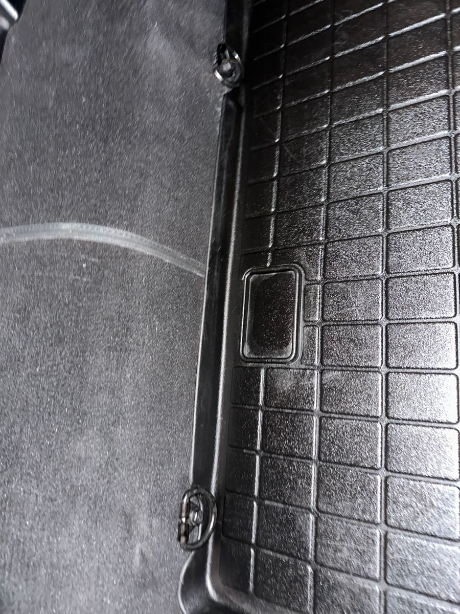 Cargo area after detailing, clean rubber liner